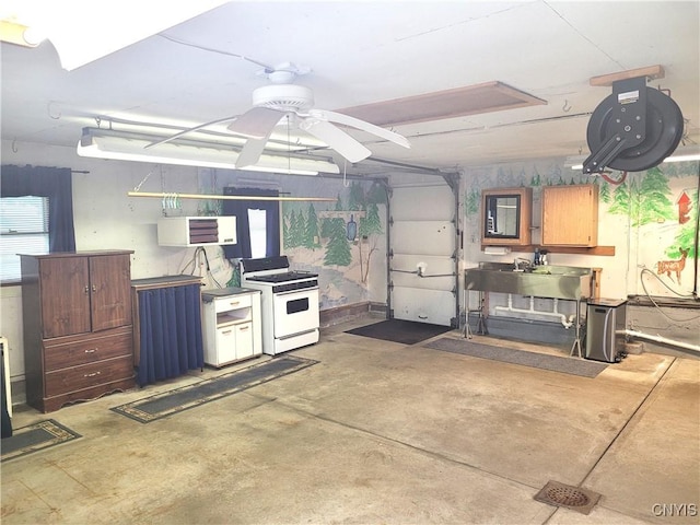 15 Beaver St, Manheim, NY 13329 - garage with a wall mounted air conditioner and ceiling fan