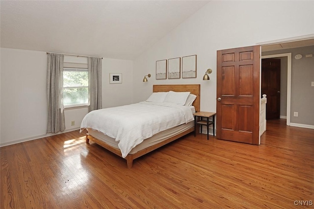 105 Maple Dr, Dewitt, NY 13066 - bedroom featuring vaulted ceiling and light wood-style floors