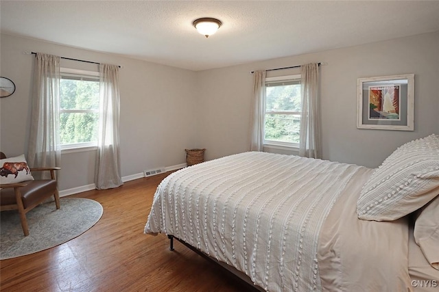 105 Maple Dr, Dewitt, NY 13066 - bedroom with wood finished floors and baseboards