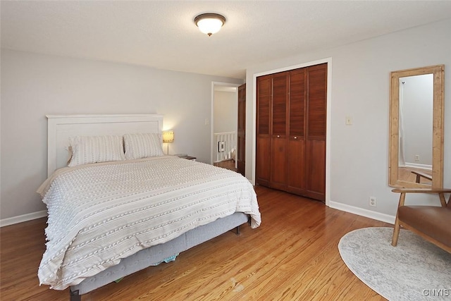 105 Maple Dr, Dewitt, NY 13066 - bedroom featuring light wood-type flooring and a closet