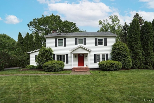 105 Maple Dr, Dewitt, NY 13066 - colonial inspired home featuring a chimney and a front yard