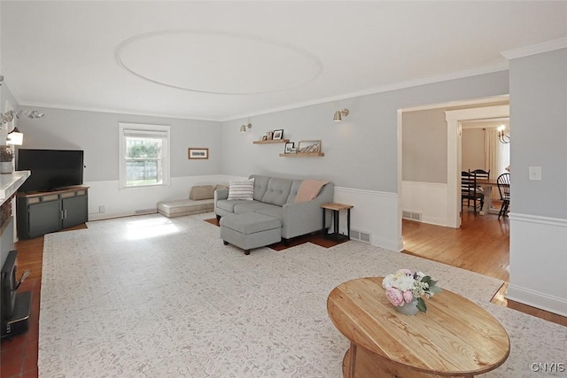 105 Maple Dr, Dewitt, NY 13066 - living room featuring crown molding and wood finished floors