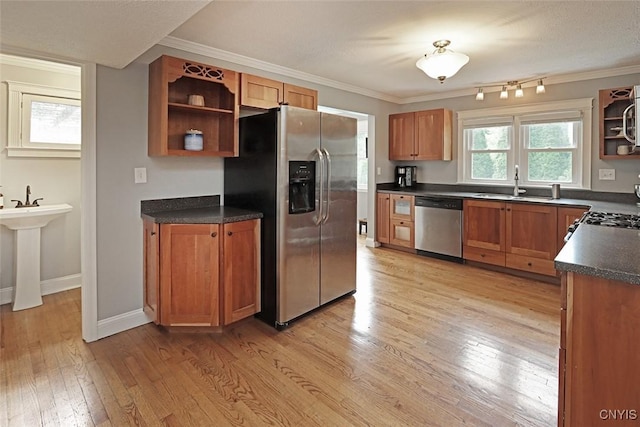 105 Maple Dr, Dewitt, NY 13066 - kitchen featuring appliances with stainless steel finishes, open shelves, dark countertops, light wood-type flooring, and crown molding