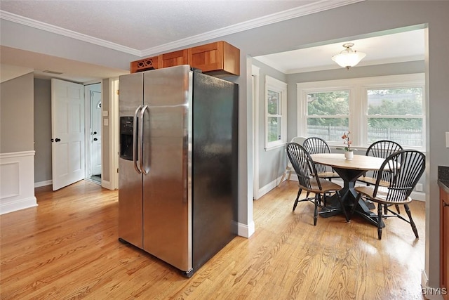 105 Maple Dr, Dewitt, NY 13066 - kitchen featuring stainless steel fridge, light wood-style flooring, crown molding, and brown cabinets