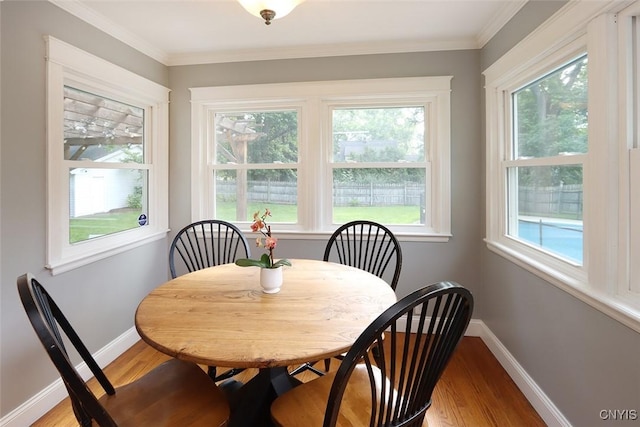 105 Maple Dr, Dewitt, NY 13066 - dining space featuring light wood finished floors and crown molding