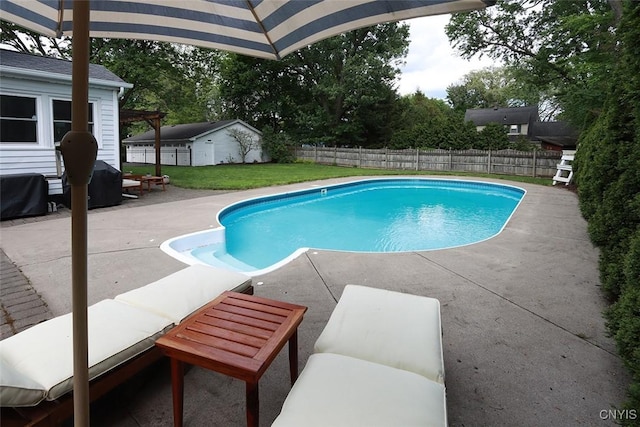 105 Maple Dr, Dewitt, NY 13066 - view of swimming pool with a patio, a fenced backyard, and an outbuilding