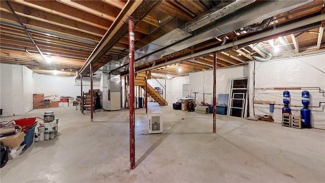 3409 Fieldstone Ln, Erwin, NY 14870 - unfinished below grade area featuring heating unit and stairs