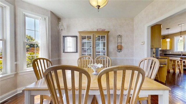 3409 Fieldstone Ln, Erwin, NY 14870 - dining area with dark wood-type flooring and baseboards