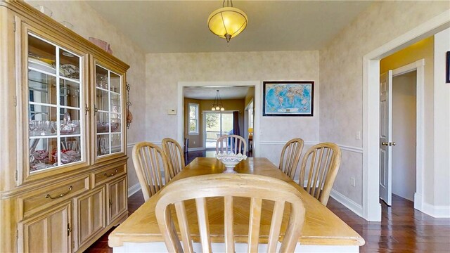 3409 Fieldstone Ln, Erwin, NY 14870 - dining area featuring dark wood-type flooring and baseboards