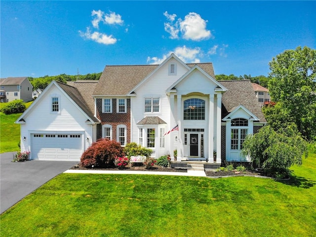 3409 Fieldstone Ln, Erwin, NY 14870 - view of front of home with driveway, a front lawn, a garage, and roof with shingles