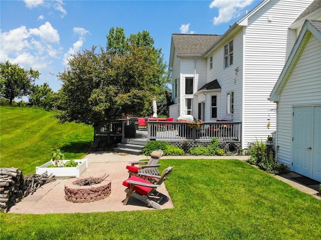 3409 Fieldstone Ln, Erwin, NY 14870 - view of grassy yard with a fire pit, a patio, and a deck
