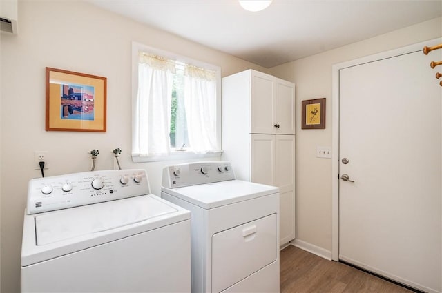 11 Keystone Ct, Sweden, NY 14420 - washroom with washer and clothes dryer, cabinet space, and light wood-style flooring