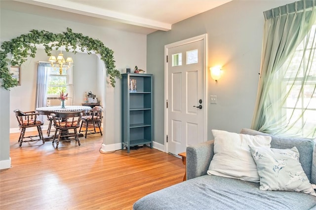 1463 Lehigh Station Rd, Henrietta, NY 14467 - entryway with plenty of natural light, light wood-type flooring, a chandelier, and beam ceiling