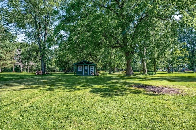 1463 Lehigh Station Rd, Henrietta, NY 14467 - view of grassy yard with an outbuilding