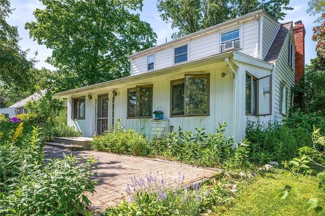 1463 Lehigh Station Rd, Henrietta, NY 14467 - view of front of property featuring a chimney and board and batten siding