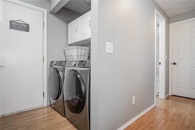 3487 Scenic Way, Walworth, NY 14502 - washroom with light wood-type flooring, washer and dryer, cabinet space, and a textured ceiling