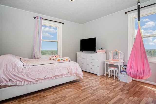 3487 Scenic Way, Walworth, NY 14502 - bedroom featuring light wood-style floors and a textured ceiling