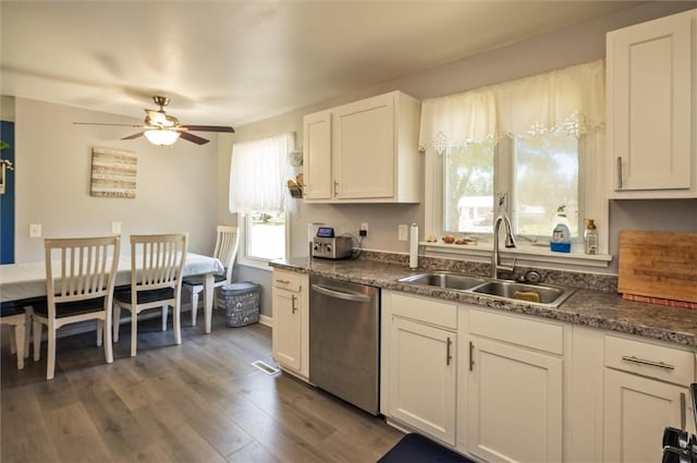 363 Kartes Dr, Greece, NY 14616 - kitchen with stainless steel dishwasher, dark wood finished floors, a ceiling fan, white cabinets, and dark countertops