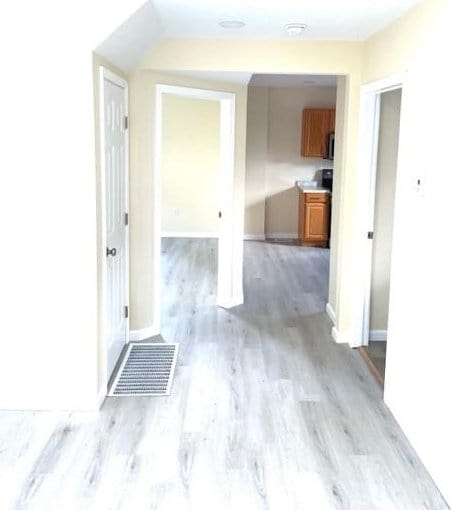 508 Baylor Rd, Elmira-City, NY 14904 - hallway with light wood finished floors and baseboards