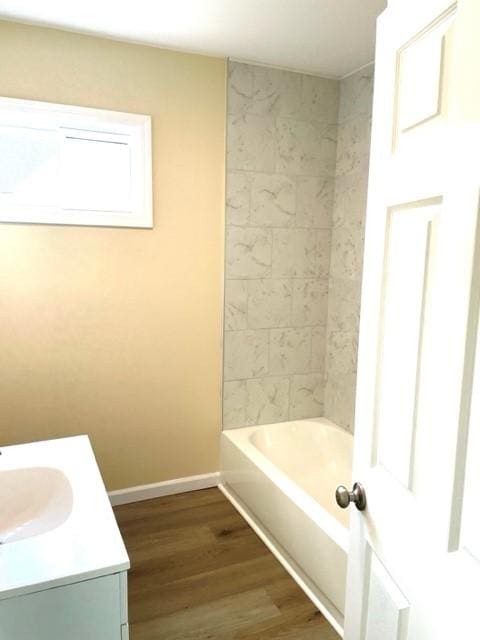 508 Baylor Rd, Elmira-City, NY 14904 - bathroom featuring wood finished floors, vanity, and washtub / shower combination