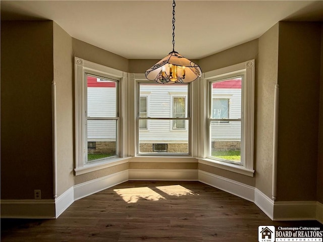 118 S 8th St, Olean-City, NY 14760 - unfurnished dining area with baseboards and dark wood finished floors