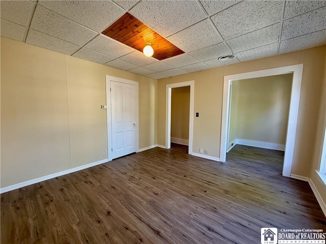 118 S 8th St, Olean-City, NY 14760 - unfurnished room with a paneled ceiling and dark wood-type flooring