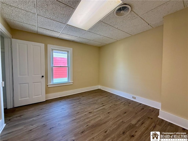 118 S 8th St, Olean-City, NY 14760 - spare room with a paneled ceiling and dark wood-type flooring