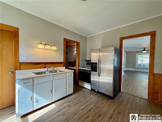 118 S 8th St, Olean-City, NY 14760 - kitchen featuring stainless steel refrigerator with ice dispenser, white gas range, ornamental molding, light wood finished floors, and light countertops