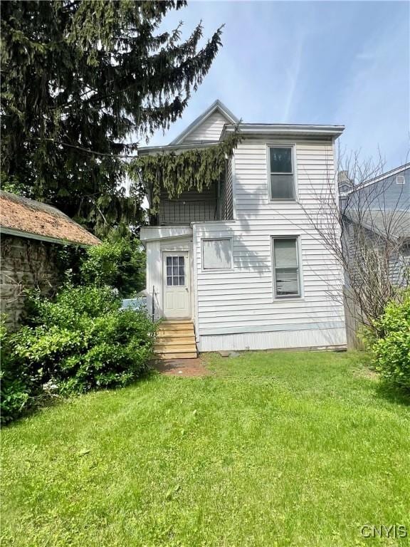 22-24 N Fulton St, Auburn, NY 13021 - back of property with entry steps and a yard