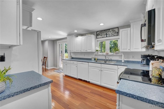 4964 Meadowbrook Rd, Clarence, NY 14221 - kitchen featuring dishwasher, white cabinets, recessed lighting, light wood-style floors, and dark countertops