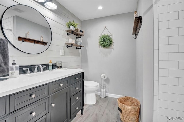 4964 Meadowbrook Rd, Clarence, NY 14221 - bathroom featuring vanity, wood finished floors, and wood walls