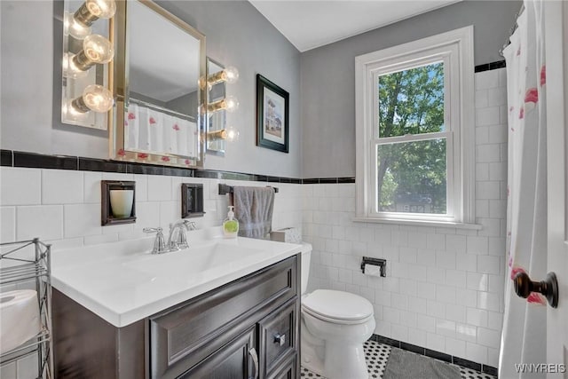 4964 Meadowbrook Rd, Clarence, NY 14221 - full bathroom with tile walls, vanity, tile patterned flooring, and wainscoting
