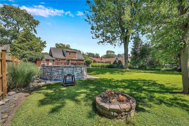 4964 Meadowbrook Rd, Clarence, NY 14221 - fenced yard with an outdoor pool and a fire pit