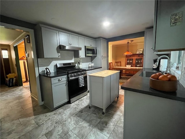 5 White Birch Cir, Chili, NY 14624 - kitchen with stainless steel appliances, under cabinet range hood, a center island, decorative backsplash, and butcher block countertops