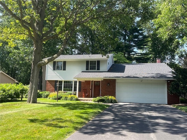 5 White Birch Cir, Chili, NY 14624 - traditional-style home featuring brick siding, asphalt driveway, a garage, and a front lawn