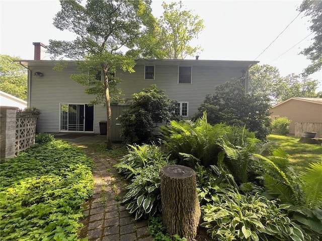 5 White Birch Cir, Chili, NY 14624 - rear view of house with a chimney