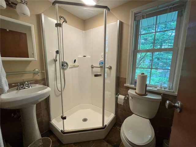 5 White Birch Cir, Chili, NY 14624 - bathroom featuring a stall shower, tile walls, and tile patterned flooring