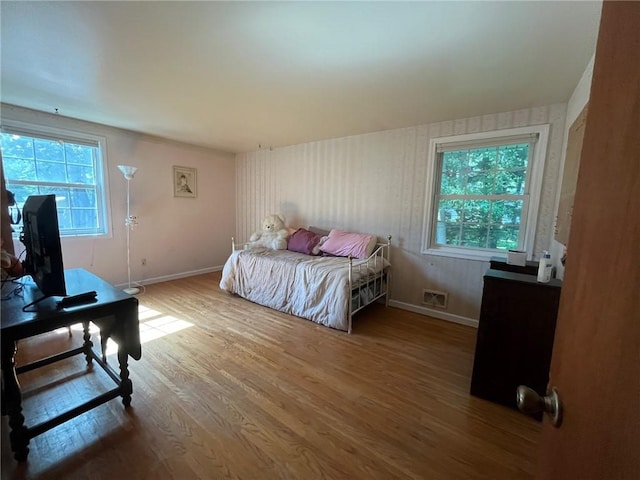 5 White Birch Cir, Chili, NY 14624 - bedroom with wood finished floors and multiple windows