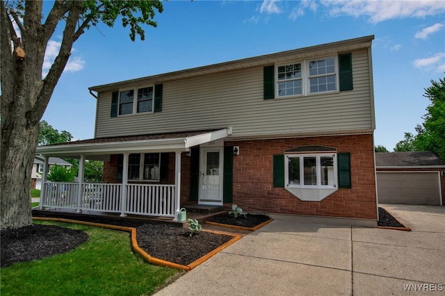 355 Fawn, West Seneca, NY 14224 - traditional-style house featuring covered porch, driveway, and a detached garage
