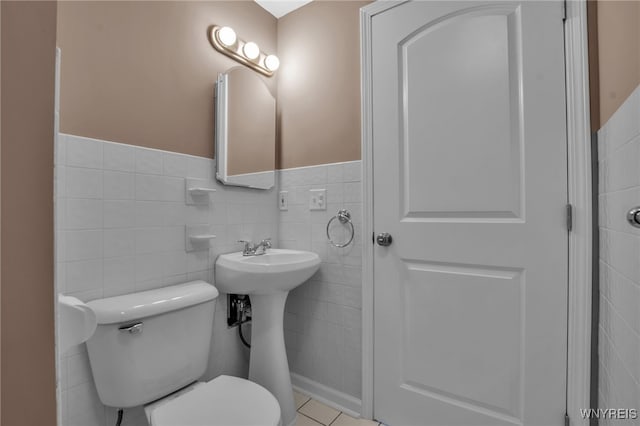 355 Fawn, West Seneca, NY 14224 - bathroom featuring tile walls, a wainscoted wall, and tile patterned flooring
