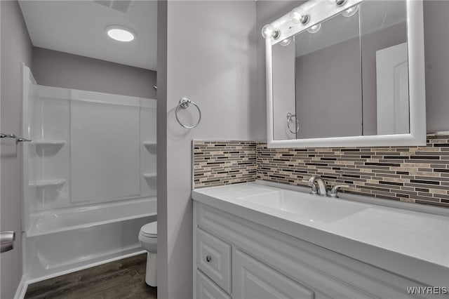 355 Fawn, West Seneca, NY 14224 - bathroom featuring vanity, wood finished floors, decorative backsplash, and  shower combination