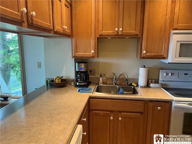 34 Oneida Dr, Chautauqua, NY 14728 - kitchen featuring white appliances, brown cabinets, and light countertops