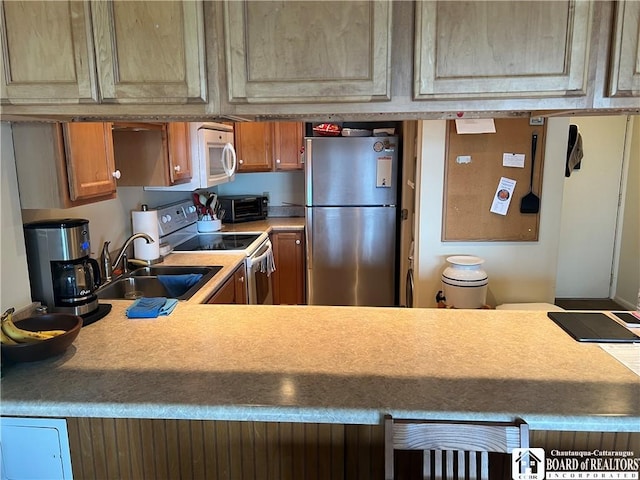 34 Oneida Dr, Chautauqua, NY 14728 - kitchen with white appliances, brown cabinetry, and light countertops