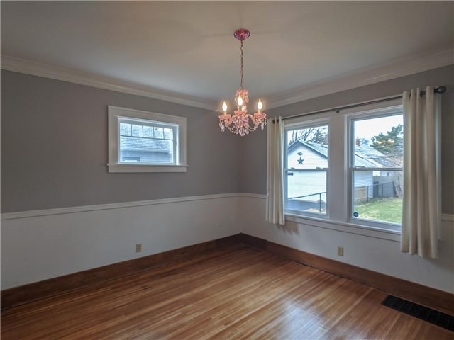 120 Whiteford Rd, Rochester, NY 14620 - empty room featuring crown molding, plenty of natural light, a chandelier, and dark wood-type flooring