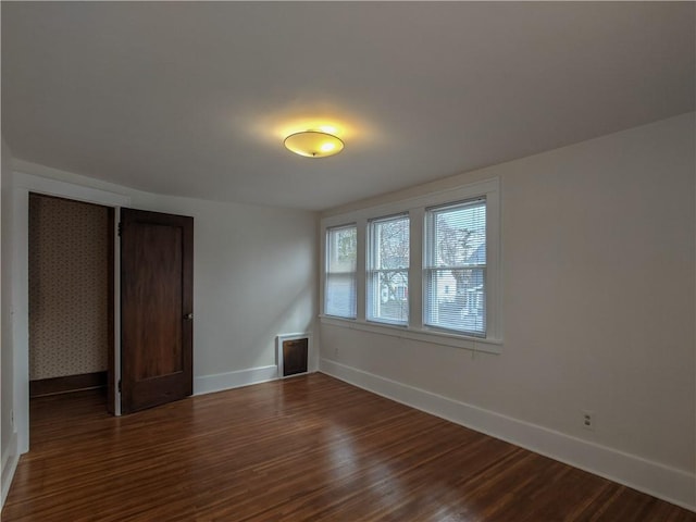 120 Whiteford Rd, Rochester, NY 14620 - unfurnished bedroom featuring dark wood finished floors and a closet