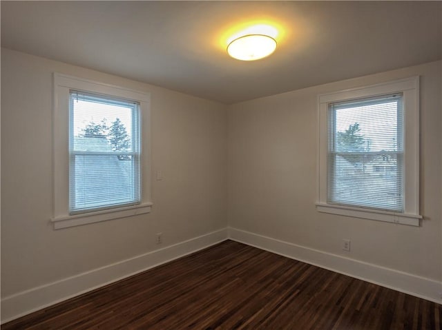 120 Whiteford Rd, Rochester, NY 14620 - spare room with dark wood-style floors and healthy amount of natural light