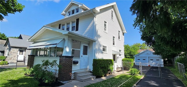 120 Whiteford Rd, Rochester, NY 14620 - american foursquare style home with entry steps, a gate, an outbuilding, and a detached garage