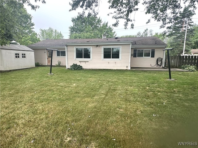 5799 Fairview Dr, Cambria, NY 14132 - rear view of house with an outbuilding, a chimney, and a patio