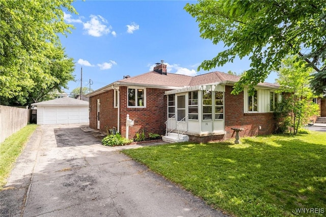 36 Lennox Ave, Amherst, NY 14226 - view of front of house with brick siding, an outdoor structure, a front yard, and a chimney