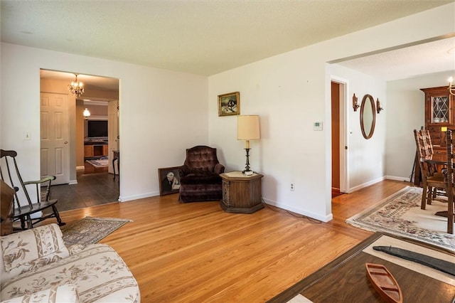 158 Pine Valley Dr, Greece, NY 14626 - living area featuring a chandelier and wood finished floors